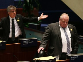 Mayor Rob Ford debates the food trucks on April 3, 2014 as Councillor Cesar Palacio gestures behind him. (Craig Robertson/Toronto Sun)