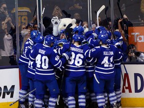 The Maple Leafs celebrate an overtime win over the Boston Bruins on April 3 (Michael Peake, Toronto Sun)