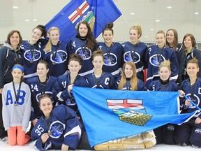 Members of the gold medal Inferno included from left to right: (Front):  Christine Chauvet; (Middle row):  Jayde Boyechko, (hostess from Winnipeg Ringette), Kelsey Flaming, Bella Haryett, Rachel St. Pierre, Larissa Rignanesi, Kennedy Wilson, Rhandi Berndt; (Back row:  Sandy Flaming (assistant coach), Cory Kulak-Berndt (manager), Cateline Joly, Jenna Stumbur, Kailyn Bell, Jill Suitor, Kaitlyn Miller, Samantha Galasso, Elizabeth St. Pierre (trainer), Jackie St. Pierre (coach), Kristen Grise (assistant coach). - Photo Supplied