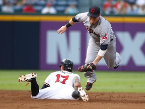 Atlanta Braves runner Jordan Schafer (17) steals the base as Cleveland Indians second baseman Jason Kipnis makes a late tag during MLB play in Atlanta, August 28, 2013. (REUTERS/Tami Chappell)