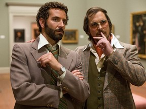 Bradley Cooper, left, and Christian Bale star in David O. Russell’s "American Hustle."