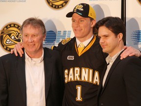 Jakob Chychrun is selected first overall by the Sarnia Sting in the 2014 OHL Priority Selection draft Friday. He's pictured with Sting VP Operations Bill Abercrombie, and director of scouting Nick Sinclair. TYLER KULA/ THE OBSERVER/ QMI AGENCY