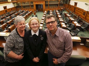Queen's Park Page Mira Donaldson, 12, with her dad, Guy and mom, Kelly on April 1, 2014. (Dave Thomas/Toronto Sun)