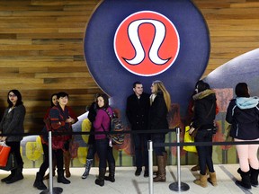 Shoppers wait in line outside Lululemon for Boxing Day sales at the Rideau Shopping Centre in Ottawa on Thursday, Dec. 26, 2013. (Matthew Usherwood/QMI AGENCY)