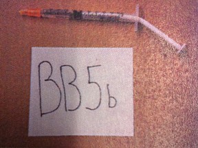 An evidence photo of a syringe. Luisa Hernandez, 46, set out a trap of cooking oil and exposed syringes before stabbing him in the neck with an insulin-loaded needle.