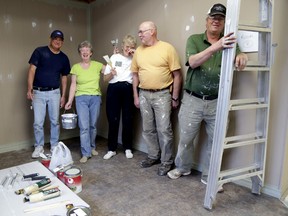 Emily Mountney/The Intelligencer
Jean McDonnell, managing director of the Central Hastings Support Network, second from left, shares a laugh with volunteers Jim Beatty, Hazel Gill, Bob Hadley and Chris Barcier Friday. The network is moving to a new location (151 St. Lawrence St. E.) and held a painting bee to help with sprucing up the new location.