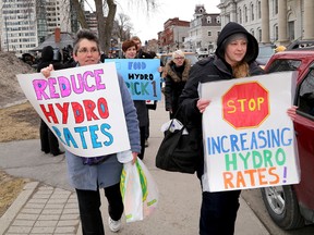 About a dozen protesters, including Susan Longmuir (left) and Rahel Levesque, not happy about rising hydro rates, marched in Kingston on Friday from Confederation Park to Kingston and the Islands MPP John Gerretsen's office. 
 IAN MACALPINE/KINGSTON WHIG-STANDARD/QMI AGENCY