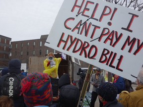 Hundreds of people rallied against hydro rates outside Energy Minister Bob Chiarelli's office Friday, April 4, 2014,  one of three-dozen towns and cities taking part in Join The Fight Against Hydro Rates, including Roger Touchette who says it cost him more to power and heat his Orleans townhouse than he gets for his disability pension.
MEGAN GILLIS/OTTAWA SUN/QMI AGENCY
