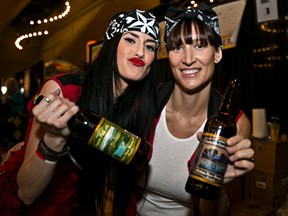 Jessi Love, left, and Nicole Bablitz pose for a photo during the 2014 International Beer Festival at the Shaw Conference Centre in Edmonton, Alta., on Thursday, April 3, 2014. Codie McLachlan/Edmonton Sun/QMI Agency
