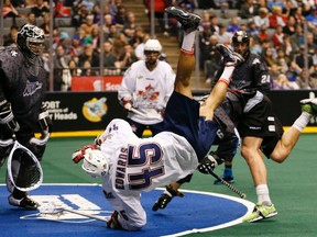 The Rock's Damon Edwards gets dumped while playing the Rush last weekend. The Rock is in Vancouver on Saturday night. (Stan Behal/Toronto Sun/QMI Agency)