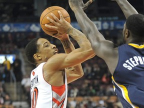 Raptors all-star DeMar DeRozan (left) shoots over the Pacers’ Lance Stephenson at the Air Canada Centre last night. (Dan Hamilton/USA TODAY SPORTS)