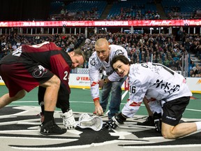 UFC fighter Georges St. Pierre drops the ceremonial first ball at an NLL lacrosse game between the Edmonton Rush and the Colorado Mammoth at Rexall Place in Edmonton, Alta., on Saturday, Jan. 11, 2014. Ian Kucerak/Edmonton Sun/QMI Agency