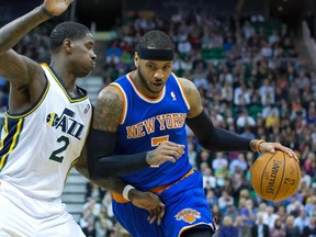 Utah Jazz forward Marvin Williams (2) defends against New York Knicks forward Carmelo Anthony (7) during the first half at EnergySolutions Arena on Mar 31, 2014 in Salt Lake City, UT, USA. (Russ Isabella/USA TODAY Sports)