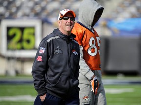 Denver Broncos head coach John Fox and tight end Virgil Green (85) look around the stadium during their "walk-through" session for the NFL Super Bowl XLVIII football game at Met Life Stadium in East Rutherford, New Jersey, February 1, 2014. (REUTERS/Ray Stubblebine)