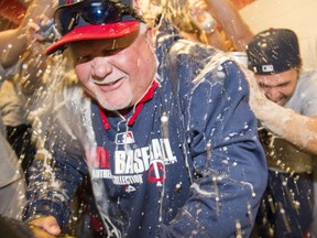 Ron Gardenhire of the Minnesota Twins celebrates with his players in the visitors dugout at Progressive Field after the Twins defeated the Cleveland Indians for Gardenhire's 1,000 carer win on April 5, 2014 in Cleveland, Ohio. (Jason Miller/Getty Images/AFP)