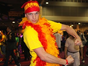 WWE fans, who have taken over New Orleans, spent the weekend enjoying Fan Axxess at the convention centre before heading to WrestleMania 30 at the Superdome Sunday. Cody Lindquist, from Kansas, does his best Hulkster pose. (Chris Doucette/Toronto Sun)