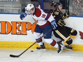 Edmonton Oil Kings centre Reid Petryk checks Brandon's Ryan Pulock during Saturday's WHL playoff game at Rexall Place (Ian Kucerak, Edmonton Sun).