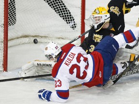 Edgars Kulda’s momentum takes him past Brandon goalie Jordan Papirny and to the ice scoring the Oil Kings’ second goal on their way to a 3-0 win over the Wheat Kings at Rexall Place on Saturday afternoon, April 5, 2014. IAN KUCERAK/Edmonton Sun