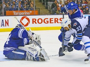 Leafs goalie James Reimer defenceman Jake Gardiner stop a short-handed chance by Jets’ Dustin Byfuglien on Saturday night at the Air Canada Centre. (DAVE ABEL/Toronto Sun)