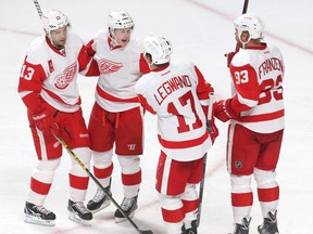 Detroit Red Wings center Pavel Datsyuk (13) celebrates his goal against Montreal Canadiens with teammates center David Legwand (17) and left wing Johan Franzen (93) and  center Gustav Nyquist (14) during the third period at Bell Centre on Apr 5, 2014 in Montreal, Quebec, CAN. (Jean-Yves Ahern/USA TODAY Sports)