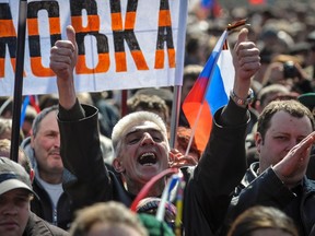 A man shouts during a pro-Russia rally near the regional government building in Donetsk April 6, 2014. Around 100 pro-Russian protesters stormed the regional government building in the eastern Ukrainian city of Donetsk on Sunday and hung up a Russian flag in defiance of Kiev's pro-European government.  REUTERS/Mikhail Maslovsky