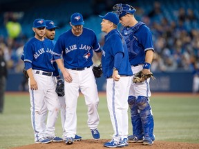 Toronto Blue Jays starting pitcher Drew Hutchison (36) is relieved during the fourth inning by manager John Gibbons (5) in a game against the New York Yankees at the Rogers Centre. (Nick Turchiaro-USA TODAY Sports)