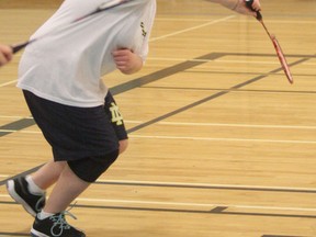 College Notre Dame's Emilie Paquette prepares to make a return during the midget girls doubles badminton final at St. Benedict on Saturday afternoon. Paquette and partner Dominique Prevost won the midget title.