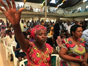 Rwandan worshippers attend the Evangelical Restoration Church, Kimisagara, one day ahead of the commemoration of the 20th anniversary of the genocide in the Rwandan capital Kigali April 6, 2014. An estimated 800,000 people were killed in 100 days during the genocide. (REUTERS/Noor Khamis)