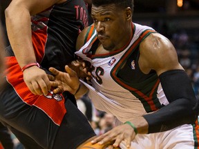 Bucks' Jeff Adrien dribbles the ball around Raptors' Chuck Hayes during a Raptors win on Saturday night. (USA Today)