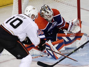 The Edmonton Oilers goalie Viktor Fasth (35)  makes a save against  the Anaheim Ducks Corey Perry (10) during second period NHL action at Rexall Place, in Edmonton Alta., on Sunday April 6, 2014. David Bloom/Edmonton Sun/QMI Agency