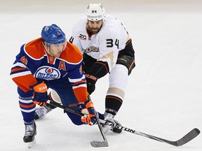 Taylor Hall skates away from Anaheim's Daniel Winnick Sunday at Rexall Place (Perry Nelson, USA Today).