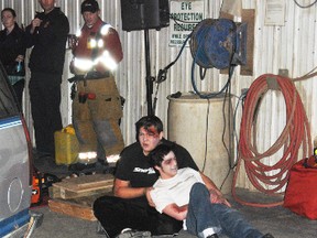 Two accident victims wait for medical treament from Emergency Medical Services personel during a P.A.R.T.Y presentation on Wednesday, April 2.
Barry Kerton | Whitecourt Star