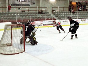 Slot Rocket John Percy fires the puck at the OPP Blues goalie Jeff Duggan and scores, making the game 5-3.