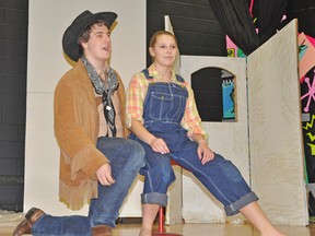 Students at Mitchell District High School present Rodgers & Hammerstein hit musical Oklahoma! on April 24, 25 & 26. Rehearsing a scene from the production are from left: Jamie Parker (who plays Curly McLain) and Sammi Duval (Laurey Williams). KRISTINE JEAN/MITCHELL ADVOCATE