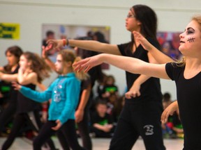 Joanna Makrostergios,9, right, of Stoney Creek Public School in London was properly made up with stitches as she and her classmates dance to Calling all Monsters by China McLain as part of the 37th annual Dance Festival being held at the Education Centre in London, Ont. on Monday April 7, 2014. 
The festival which runs all week brings in almost 4,500 students from 80 school across the Thames Valley District School Board, from JK to grade 8.
(Mike Hensen/The London Free Press/QMI Agency)