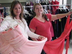 Founder Debbie Anderson, left, and volunteer co ordinator Julie Stewardson of the Cinderella Story in Sarnia, Ont., check out some of the 400 dresses donated for the prom dress giveaway.  Sixty-three girls who otherwise may not have been able to afford to dress for their prom or grad were assisted. April 13, 2013 (CATHY DOBSON, The Observer)