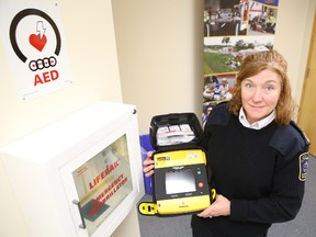 Frontenac Paramedic Service deputy chief Gale Chevalier holds an automated external defibrillator (AED), similar to the one used to save a Wolfe Island man last month.
ELLIOT FERGUSON/KINGSTON WHIG-STANDARD/QMI AGENCY
