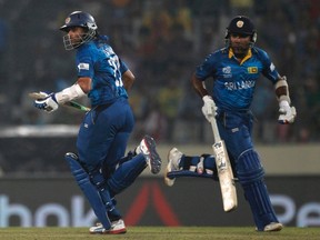 Sri Lanka's Mahela Jayawardene (right) and Tillakaratne Dilshan run between the wickets against India during their ICC Twenty20 World Cup cricket final match at the Sher-E-Bangla National Cricket Stadium in Dhaka on Sunday. (Andrew Biraj/Reuters)