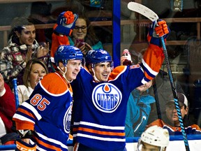 Nail Yakupov, right, celebrates a goal against the Nashville Predators in January with teammate Martin Marincin. (Codie McLachlan, Edmonton Sun)