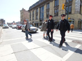 Police officers walk the beat in downtown London. (Free Press file photo)