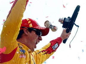 Joey Logano celebrates after winning the NASCAR Sprint Cup Series Duck Commander 500 at Texas Motor Speedway on Monday. (AFP)