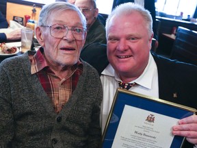 Leafs legend Wally Stanowski is presented with a proclamation from Toronto Mayor Rob Ford at a celebration of Stanowski's 95th birthday at Shopsy's restaurant in Markham on Monday. (DAVE THOMAS/Toronto Sun)