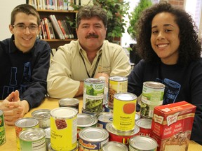 The 13th annual Cyclone Aid canned good drive for the Inn of the Good Shepherd's food bank is on this Saturday. St Patrick's high school students will be canvassing houses across Sarnia, hoping to raise a record number of donations. Pictured are campaign co-chairs and Grade 12 students Matthew Gerrits and Cheyenne Mitchell, with the Inn of the Good Shepherd's Myles Vanni.  TYLER KULA/ THE OBSERVER/ QMI AGENCY