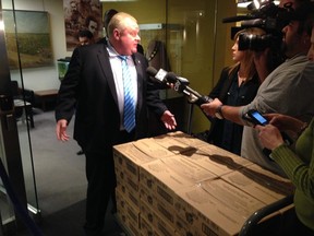 Mayor Rob Ford at City Hall with his cart of chocolate Easter eggs. (DON PEAT, Toronto Sun)