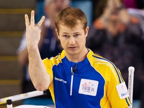 Team Alberta second Carter Rycroft gestures after skip Kevin Koe (unseen) delivered a stone in the 5th end against team British Columbia during the championship draw at the 2014 Tim Hortons Brier curling championships in Kamloops, British Columbia March 9, 2014.  REUTERS/Ben Nelms
