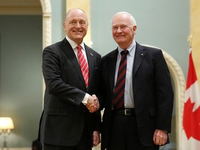 Canada's Governor General David Johnston (R) shakes hands with new U.S. Ambassador to Canada Bruce Heyman after receiving his credentials at Rideau Hall in Ottawa April 8, 2014. (REUTERS/Chris Wattie)