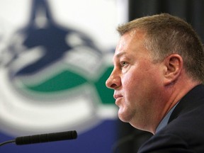 Vancouver Canucks general manager Mike Gillis speaks at a news conference in Vancouver, British Columbia June 17, 2011, two days after losing to the Boston Bruins in Game 7 of the Stanley Cup Finals. (REUTERS/Ben Nelms)
