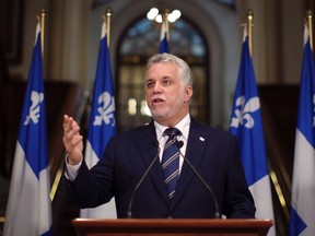 Quebec's Premier elect Philippe Couillard gestures as he speaks during a news conference at the National Assembly in Quebec City, April 8, 2014. (REUTERS/Mathieu Belanger)