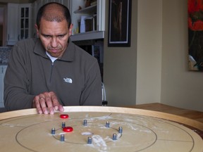 Jairo Munoz, one of the Kingston Crokinole Club co-founders, started playing the game at family parties with his in-laws. The KCC started four years ago with only four members and now has grown to 14 members.
BRIANNE STE MARIE LACROIX/KINGSTONWHIG_STANDARD/QMIAGENCY