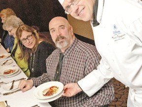 Chef Todd Pylypiw serves Mina Thaler-Adeland and husband Robert Adeland during a tasting in preparation for the 32nd annual The Meal in support of the Canadian Diabetes Association which takes place at the Hilton April 27. (Steve Grimes, Special to QMI Agency)